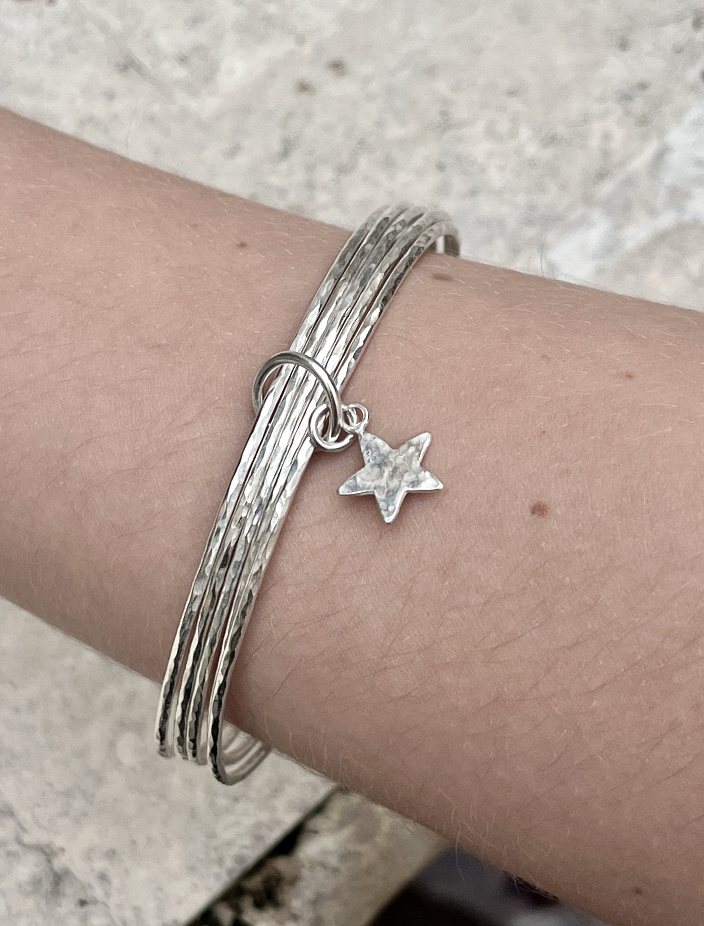 Silver star stacking bracelet.