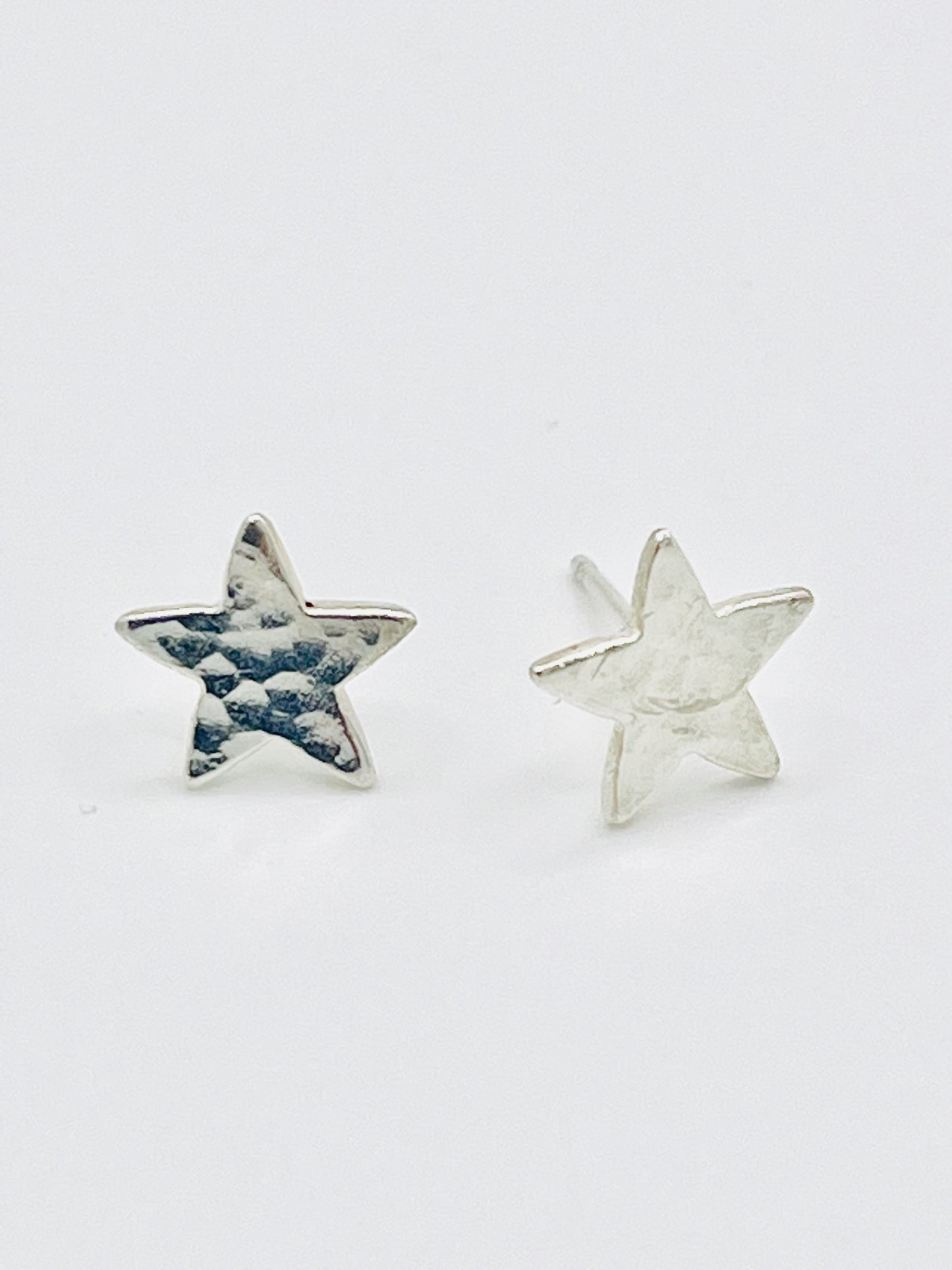 Silver star studs.