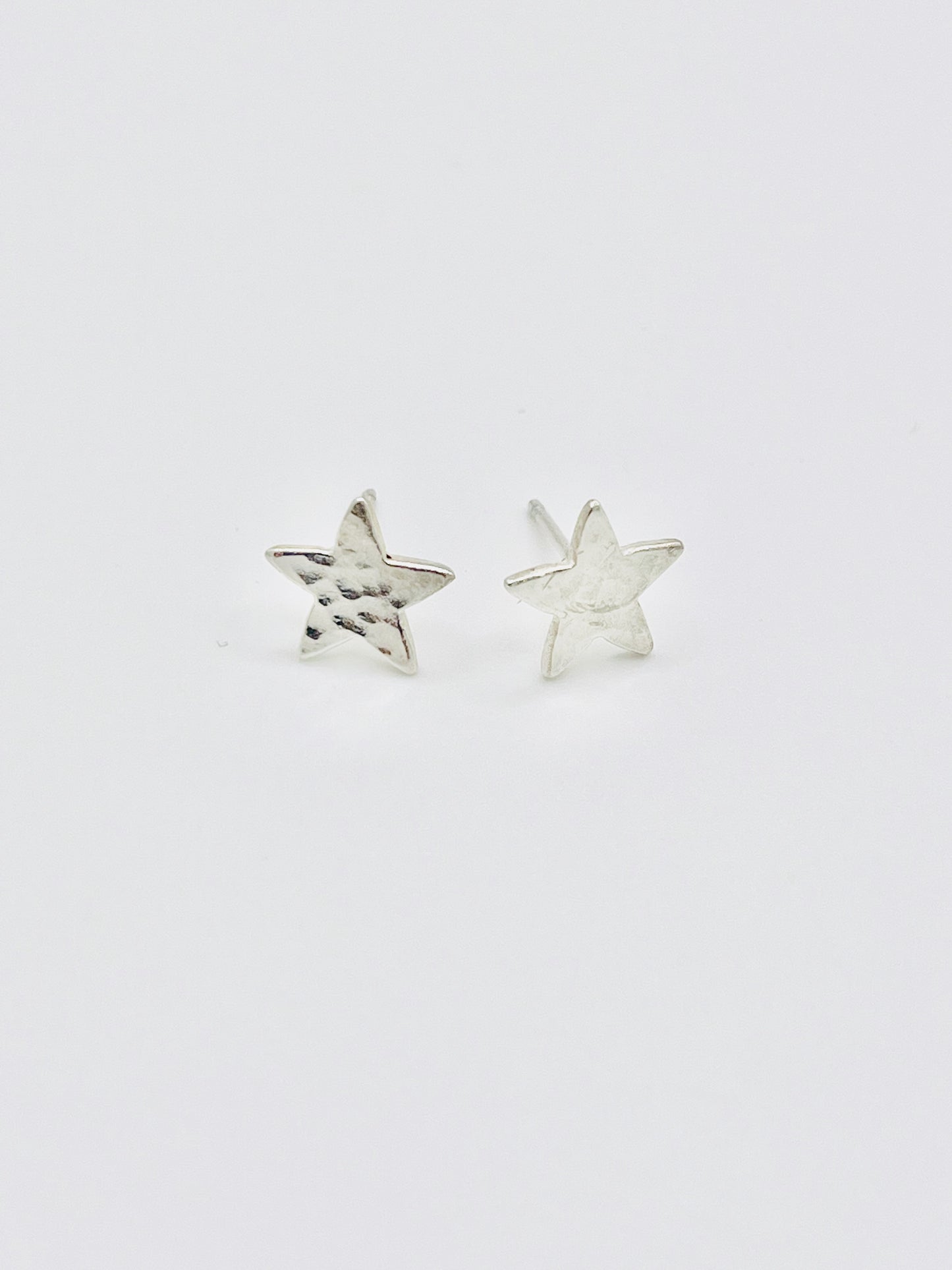 Silver star studs.