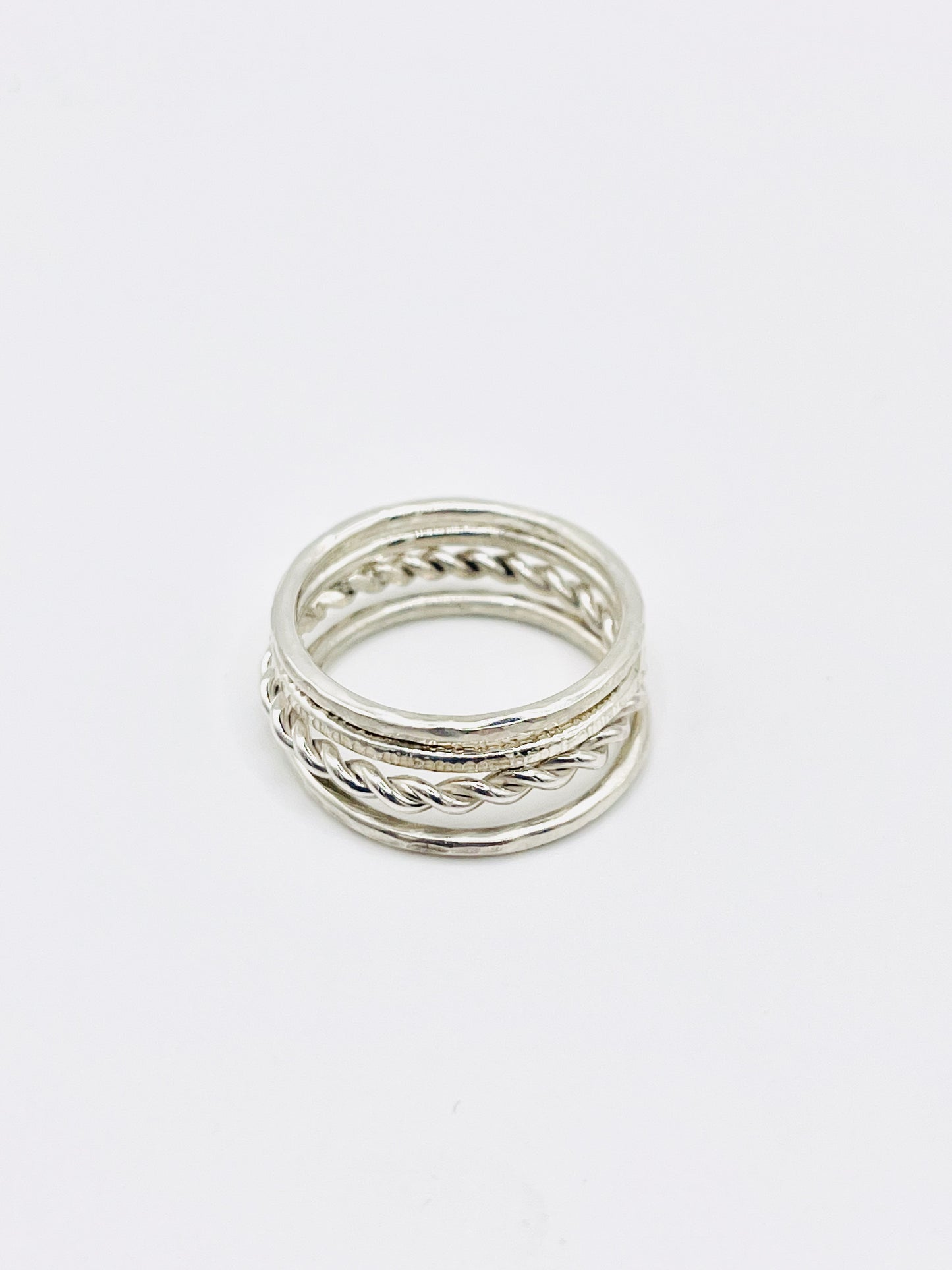 Silver Multi textured stacking ring.