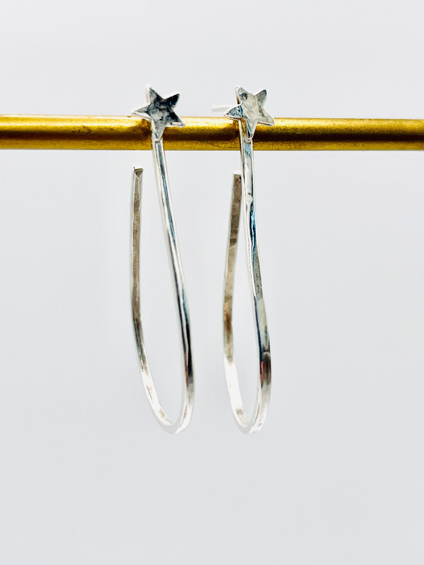 Silver star hoops.