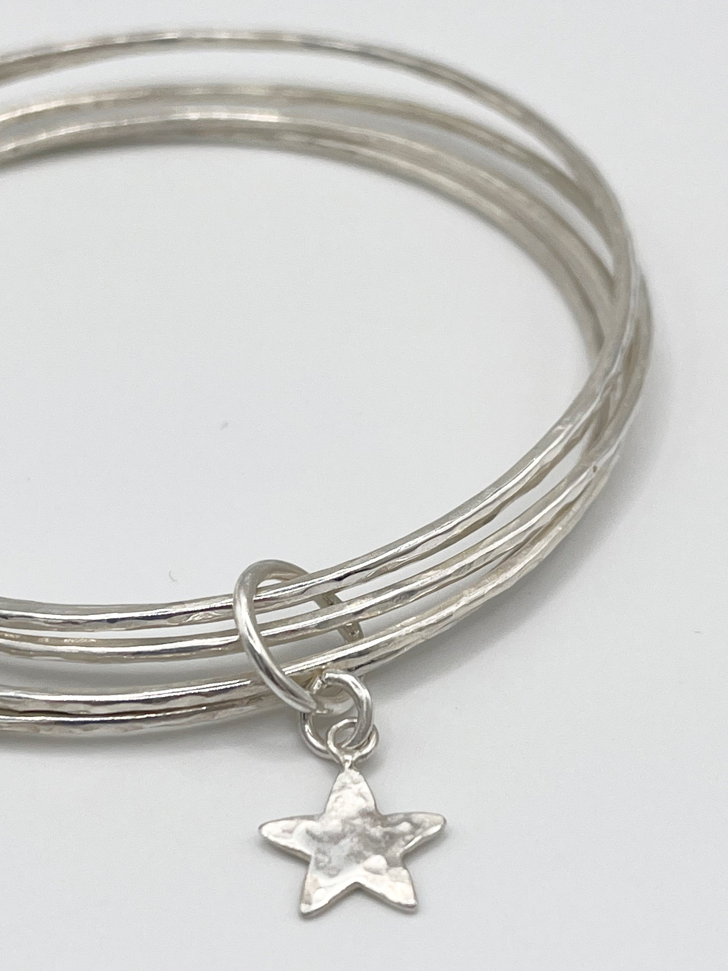 Silver star stacking bracelet.
