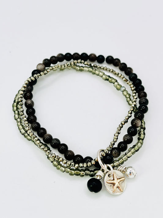 Gold starfish stacking bracelet.