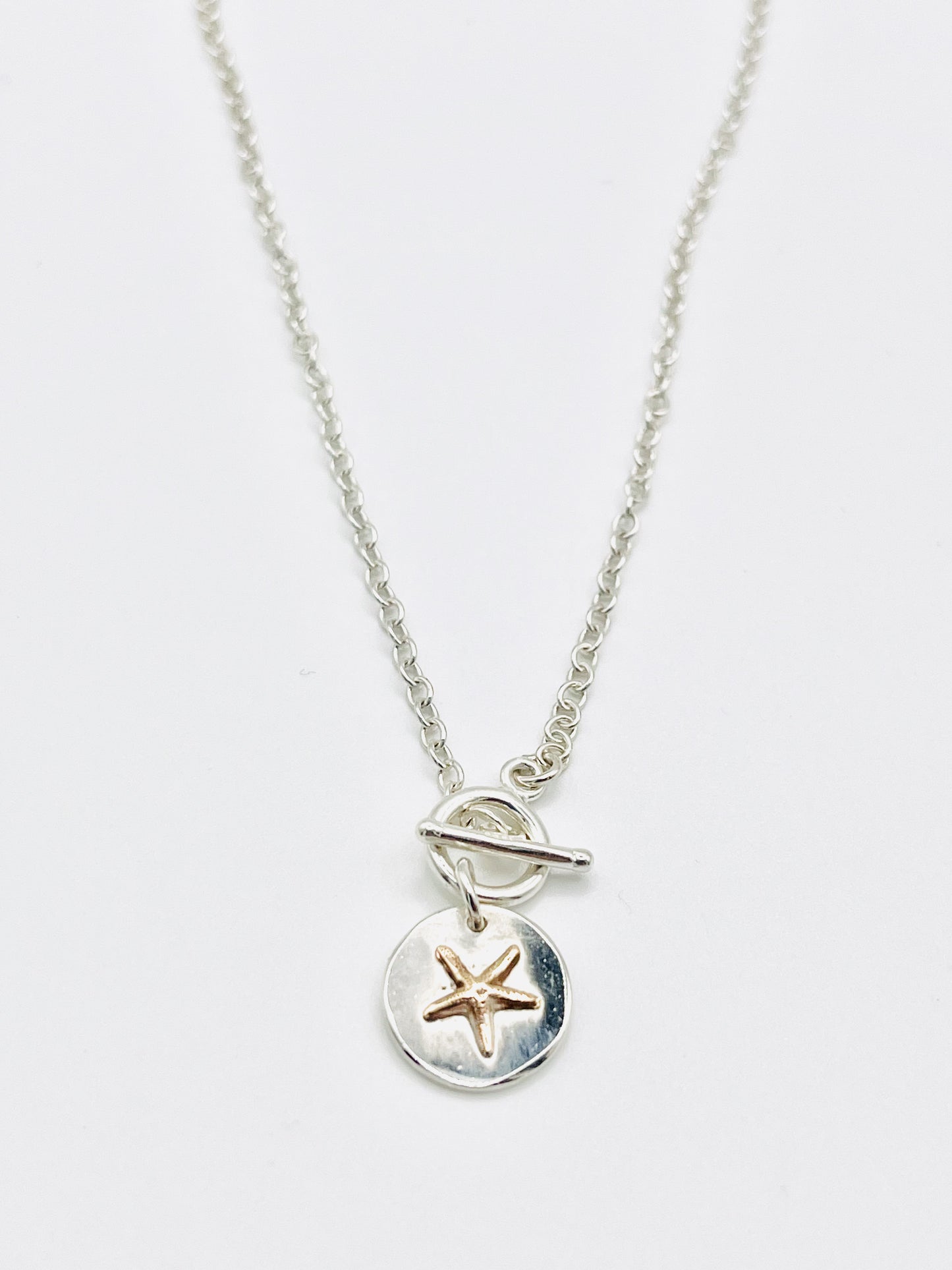 Gold starfish chain necklace.