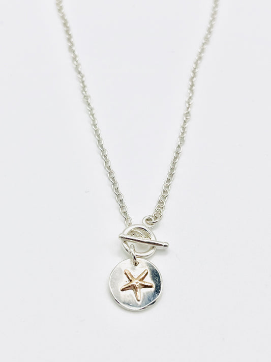 Gold starfish chain necklace.