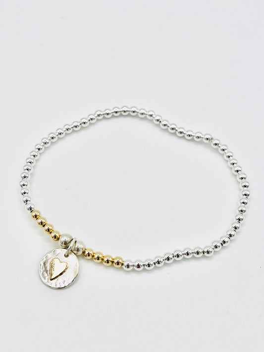 Gold heart beaded bracelet.