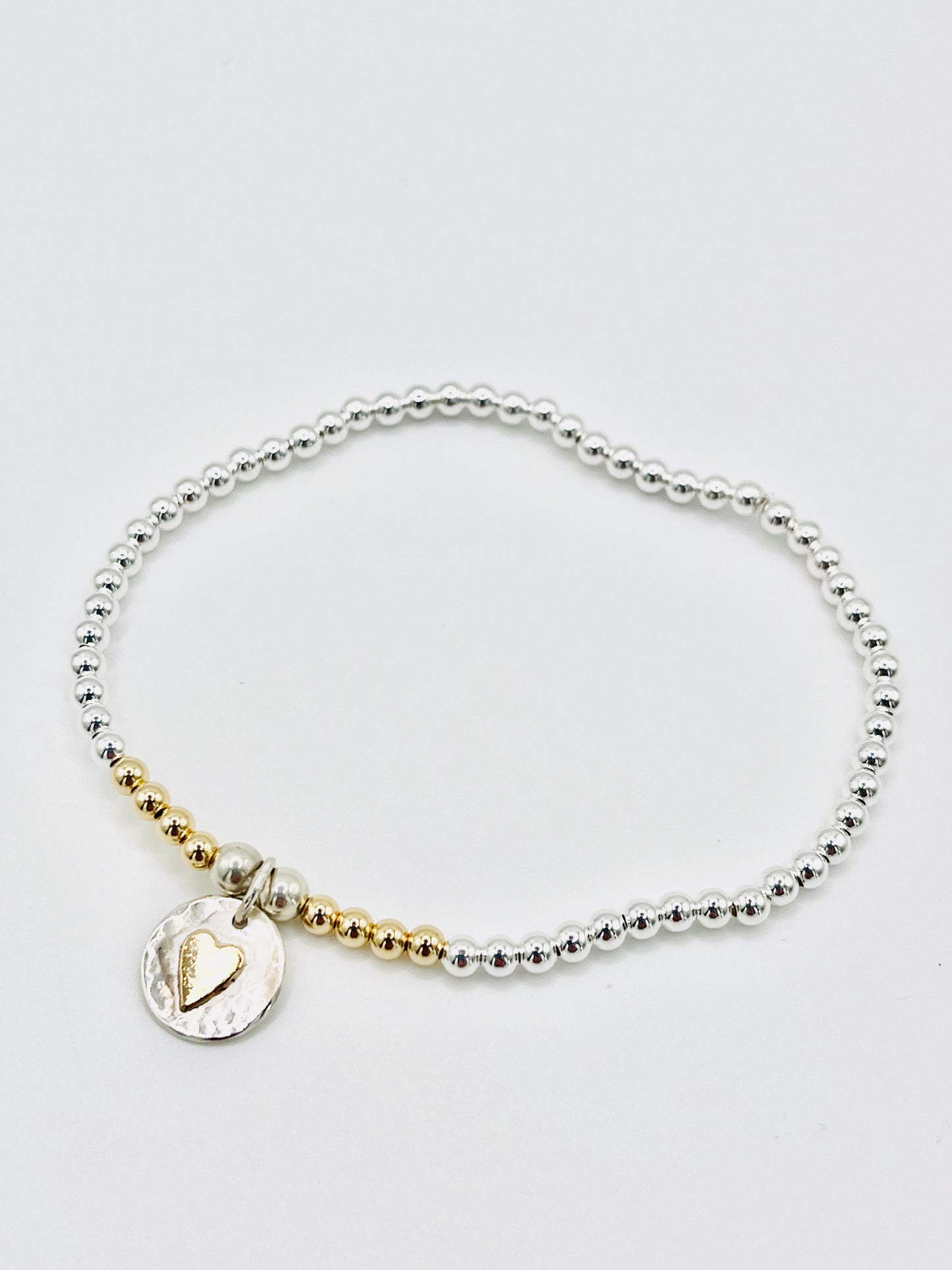 Gold heart beaded bracelet.