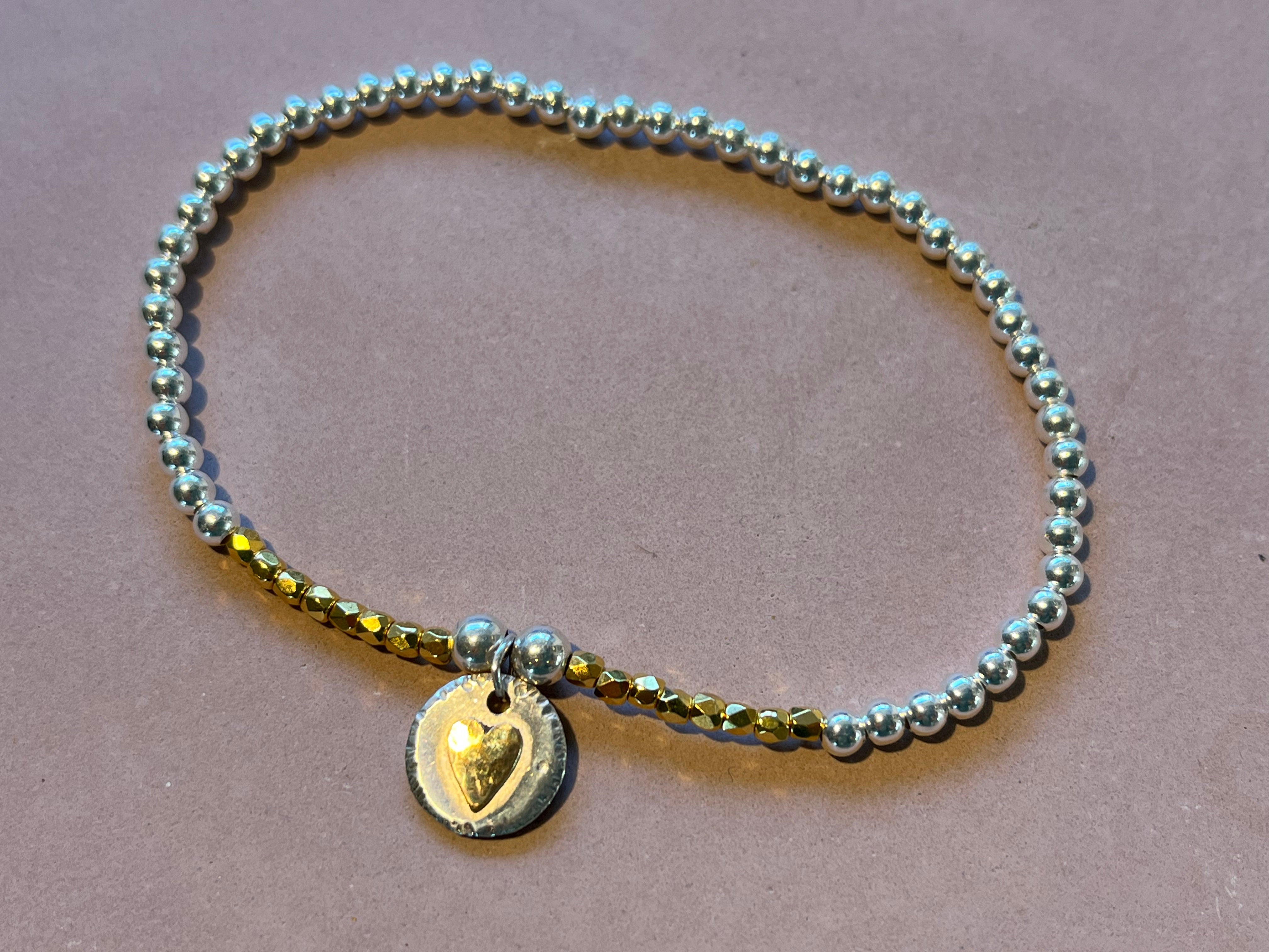 Gold heart beaded bracelet.