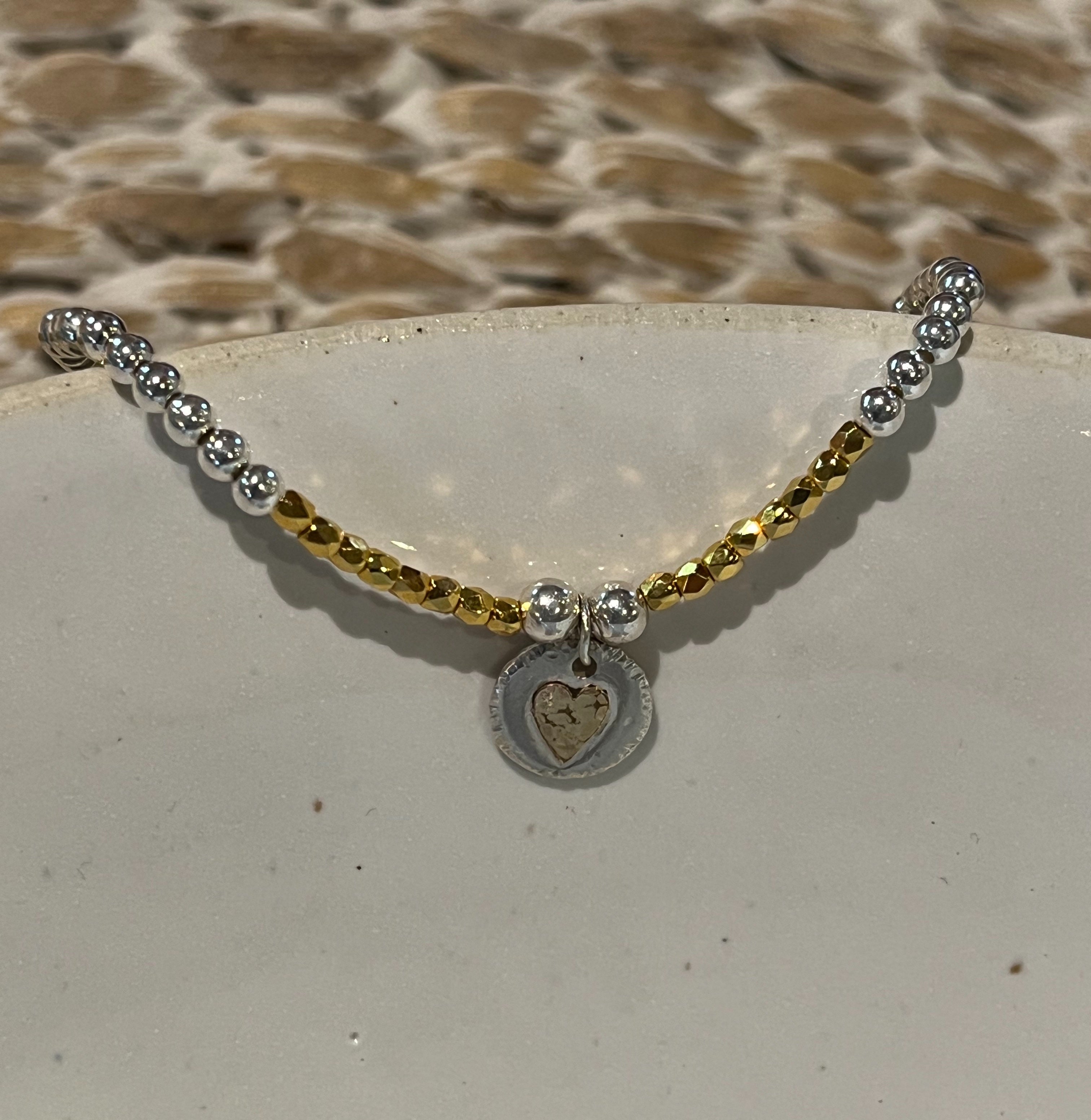 Gold heart beaded bracelet.