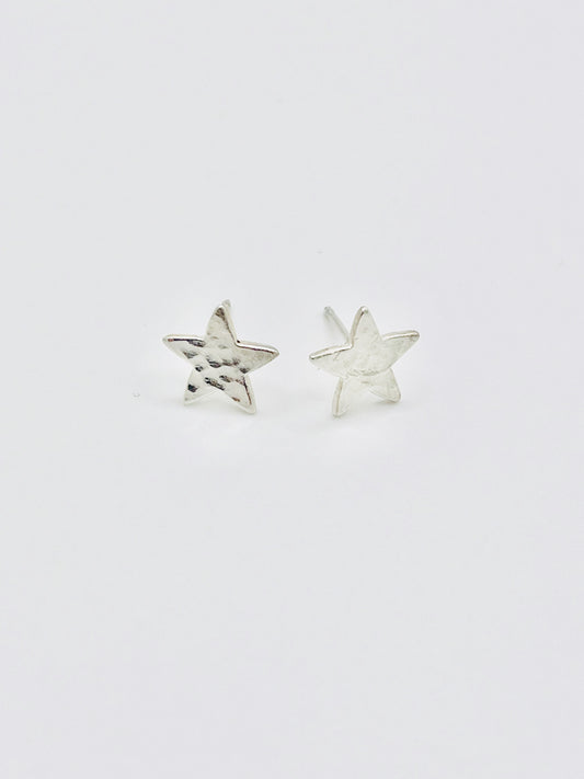 Silver star studs.