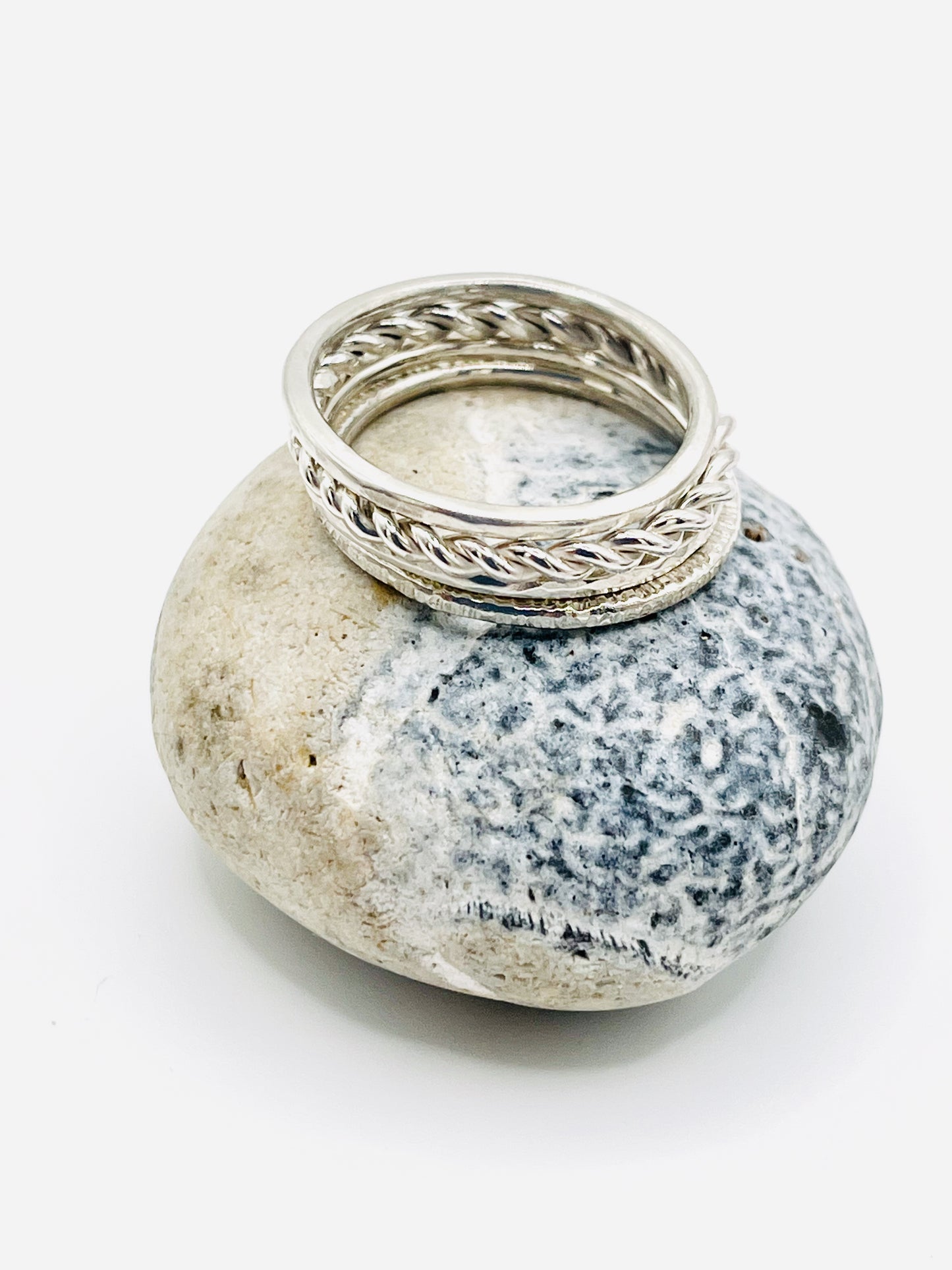 Silver Multi textured stacking ring.