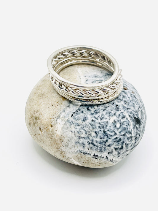 Silver Multi textured stacking ring.