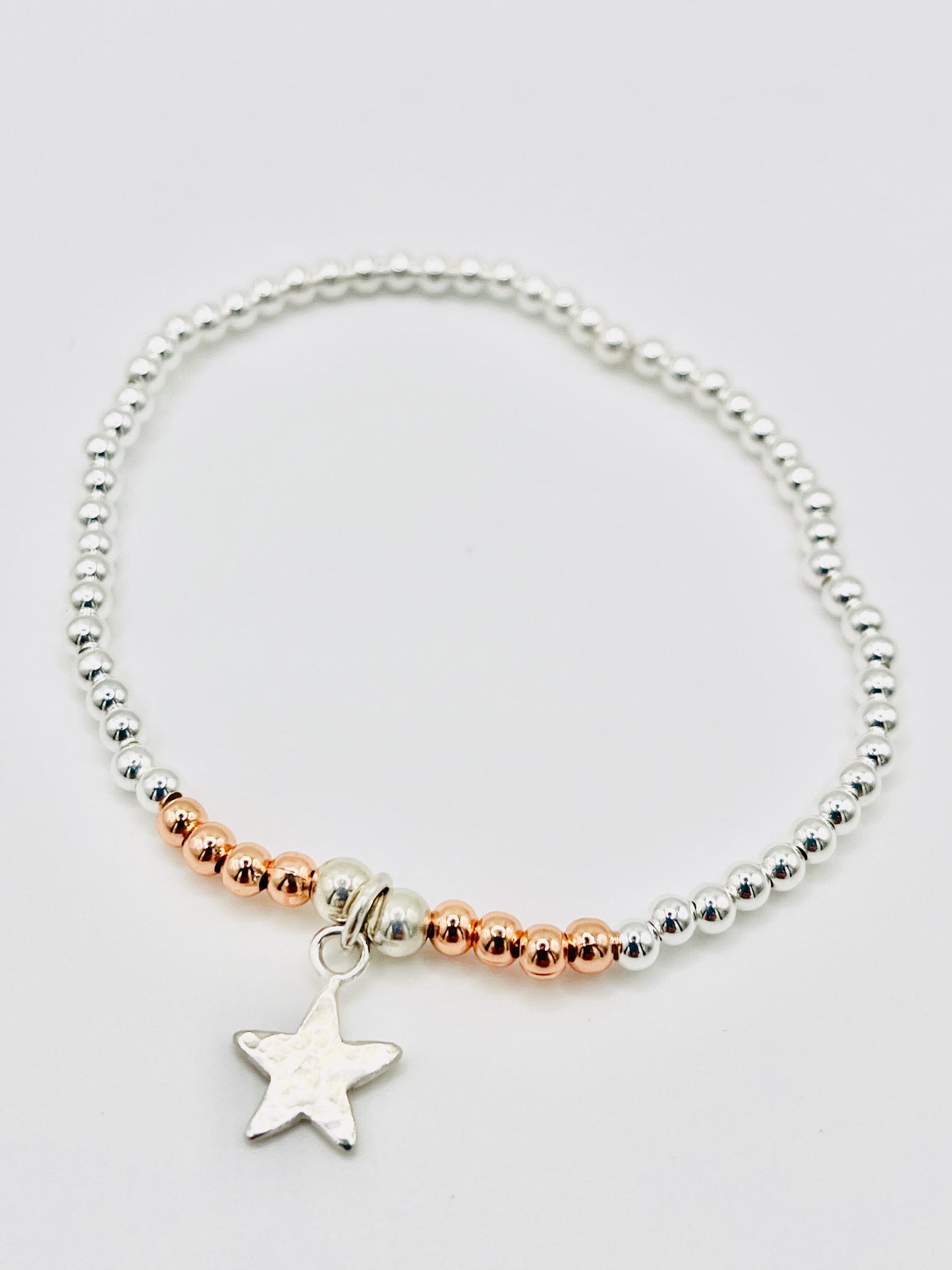 Silver beaded bracelet with silver star.