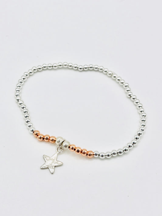Silver beaded bracelet with silver star.