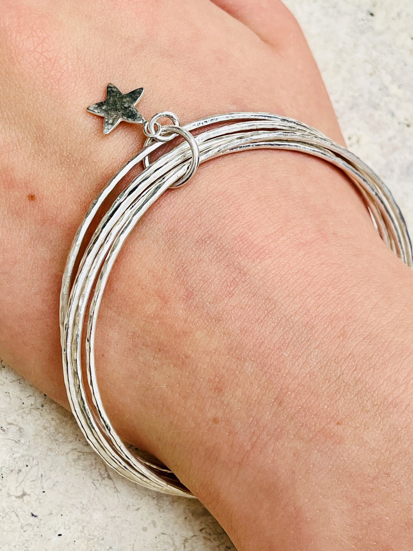 Silver star stacking bracelet.
