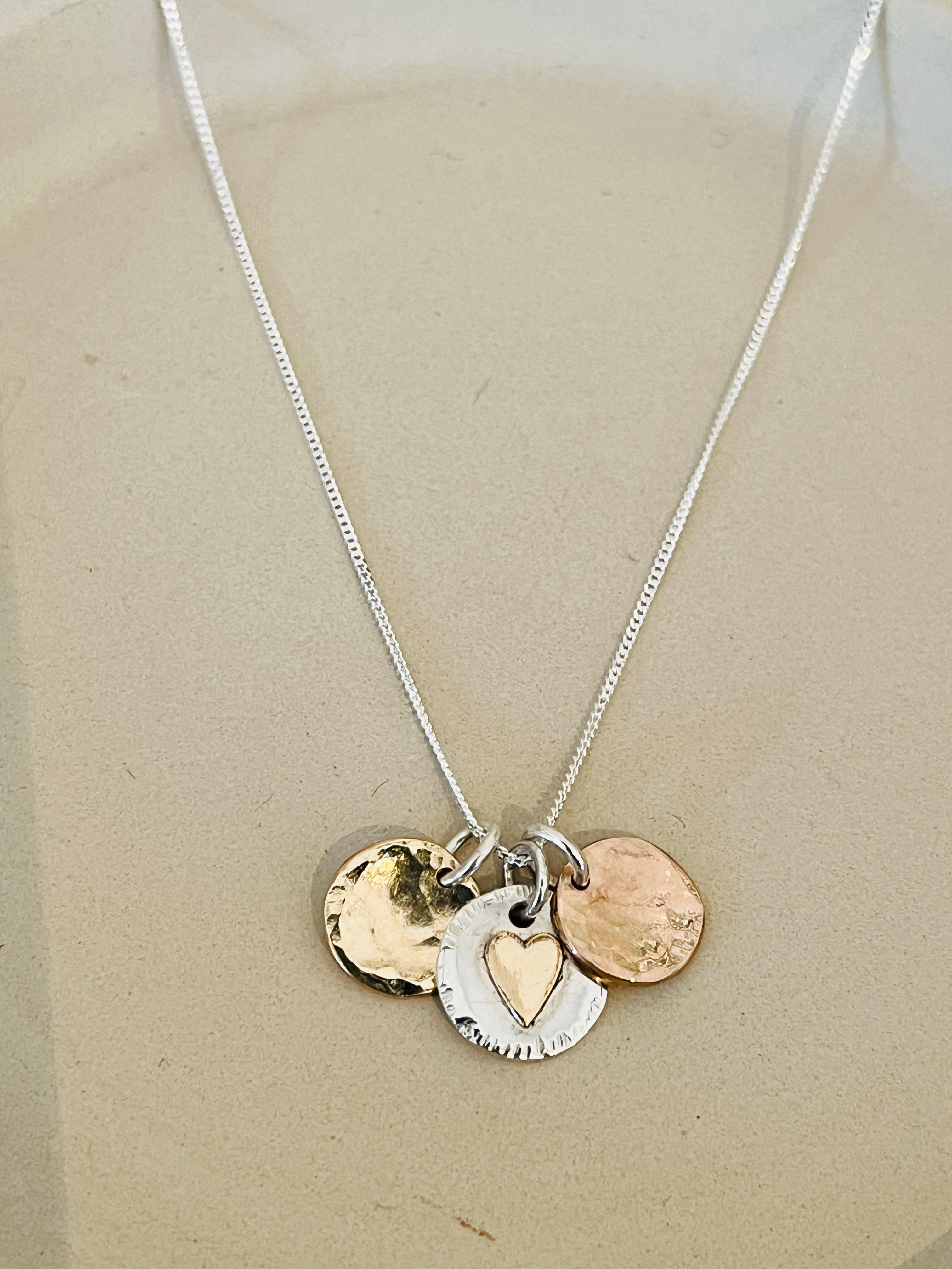 Personalised trio disc necklace.