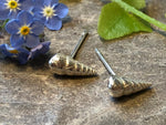 Twisted shell studs.