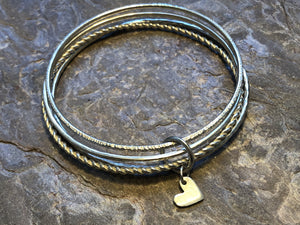 Multi textured bangle stack with personalised disc or heart.