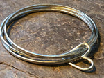 Triple stacking bangle with joining heart.