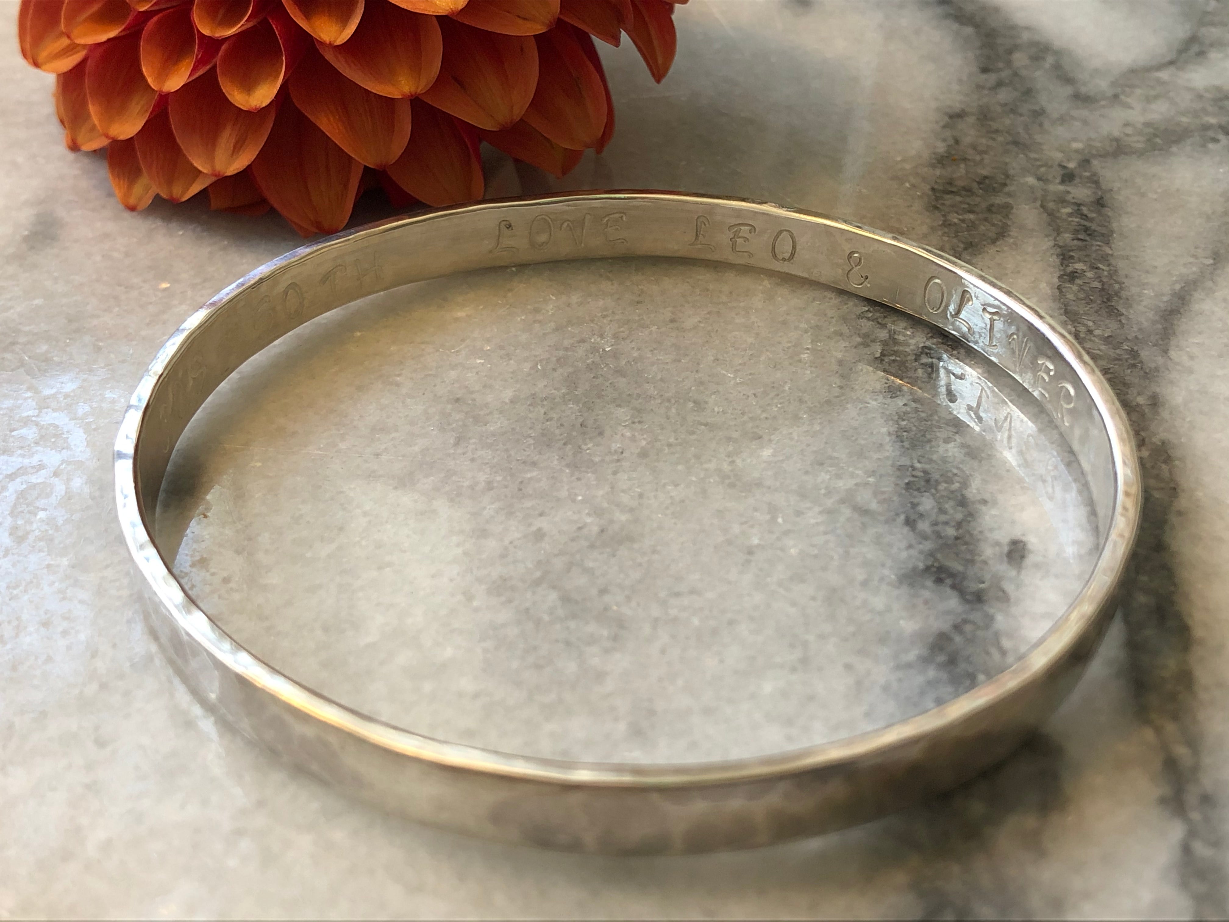 Silver Flat textured bangle with personalised inside.