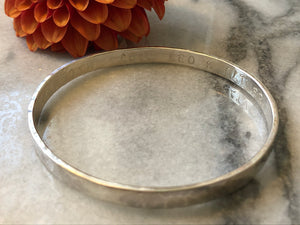 Silver Flat textured bangle with personalised inside.