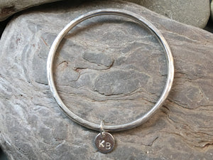 Silver bracelet with personalised heart or star.