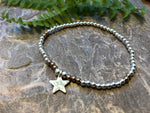 Silver beaded bracelet with personalised silver star.