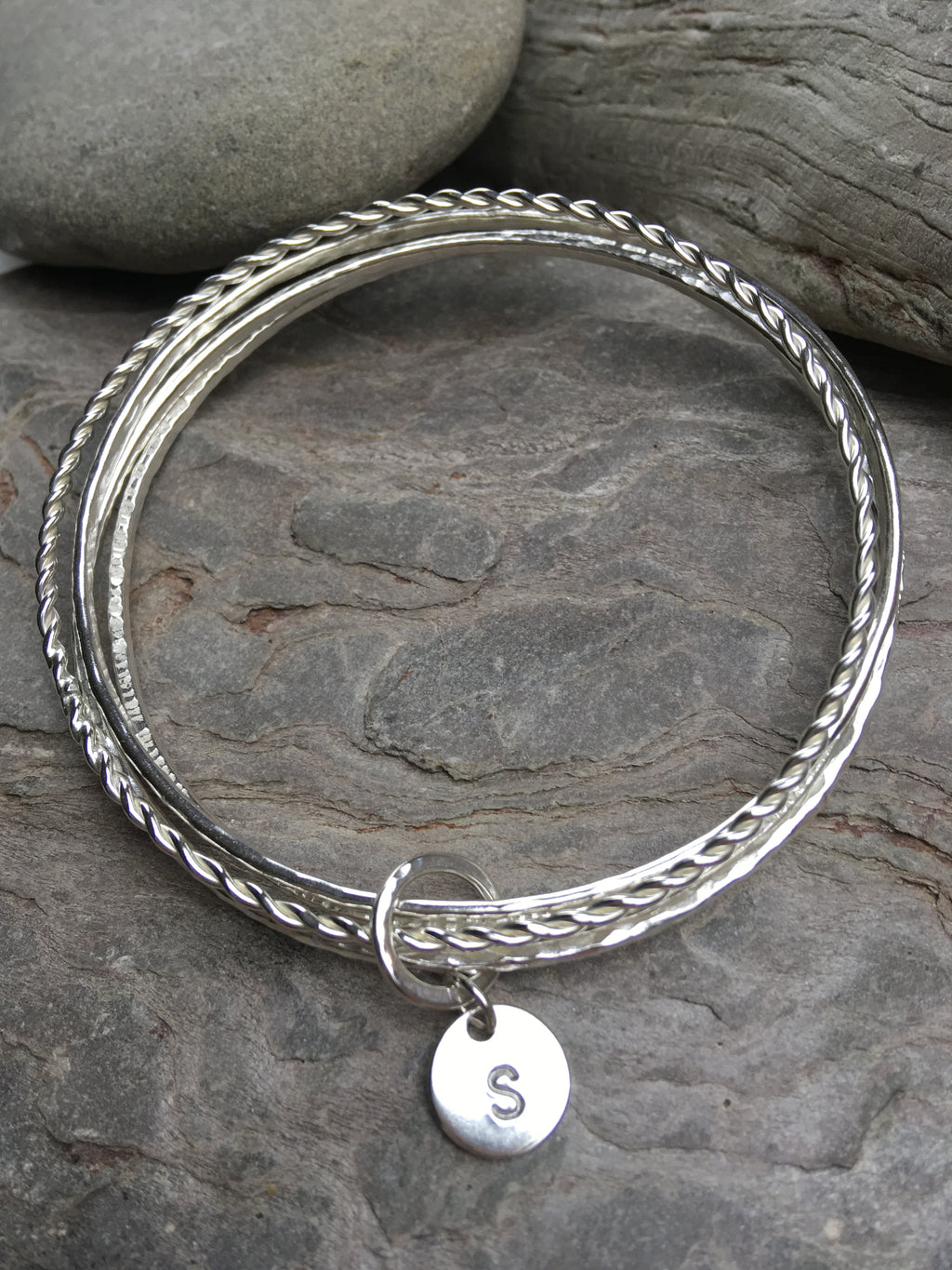Multi textured bangle stack with personalised disc or heart.