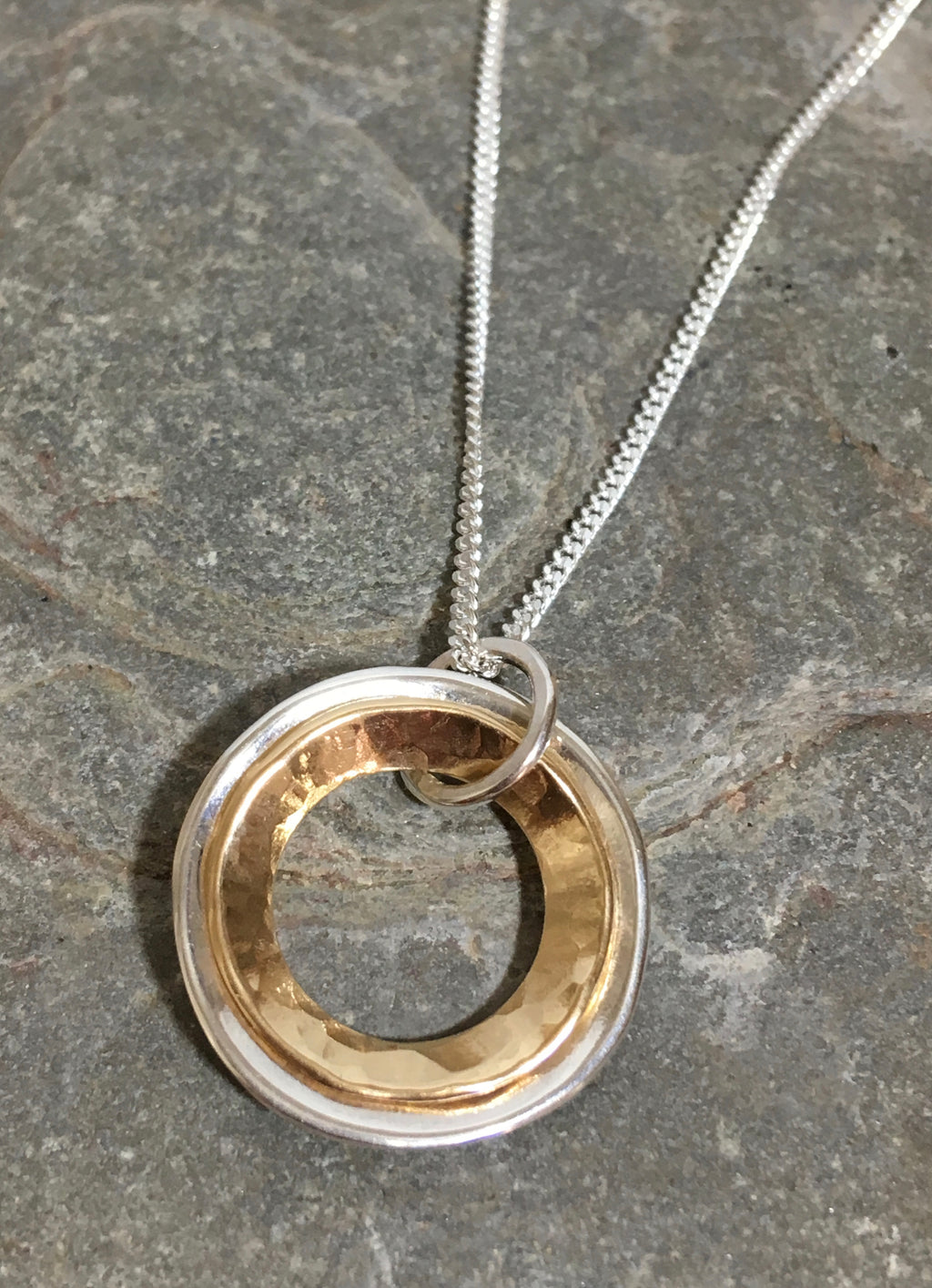 Silver and Gold domed rings necklace.