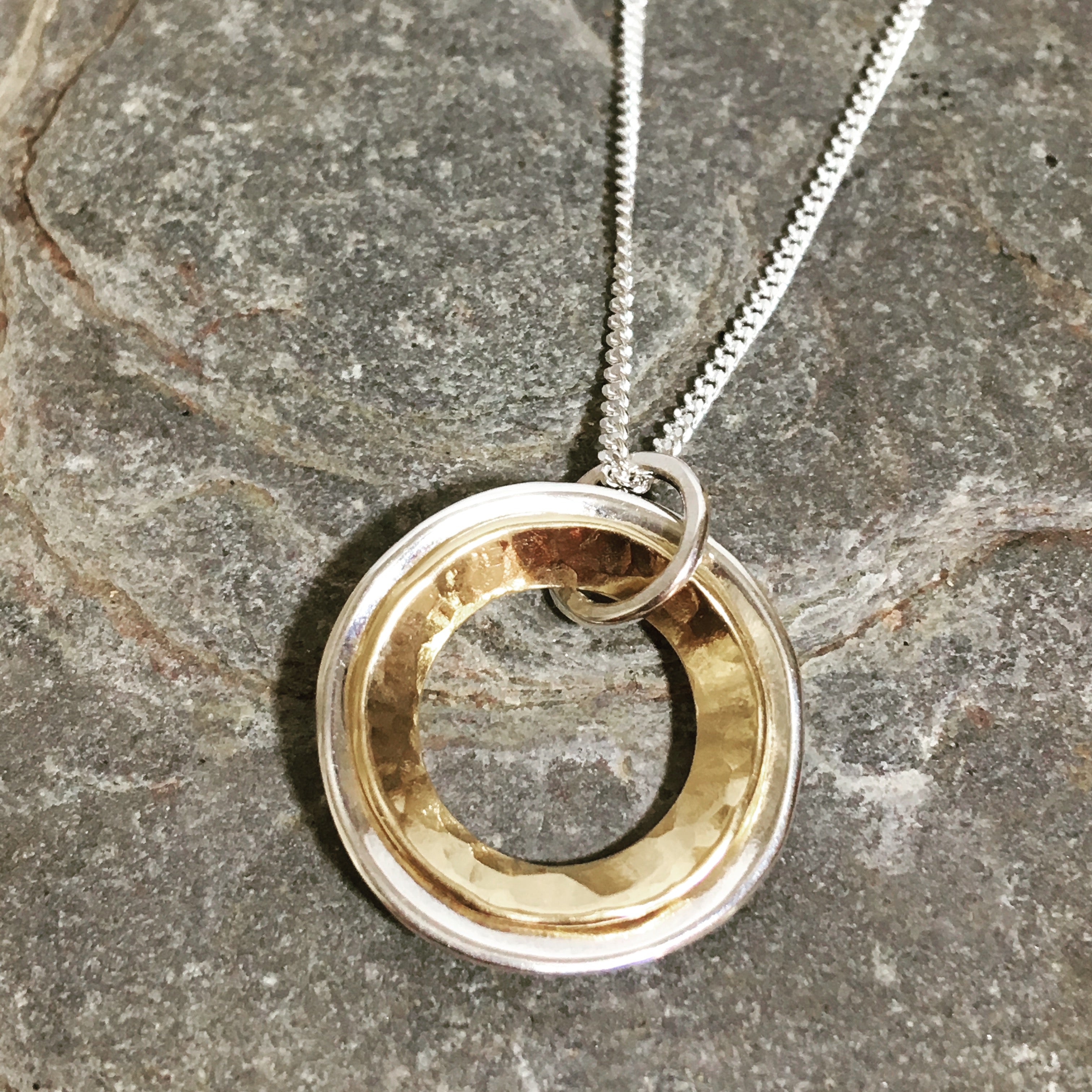 Silver and Gold domed rings necklace.