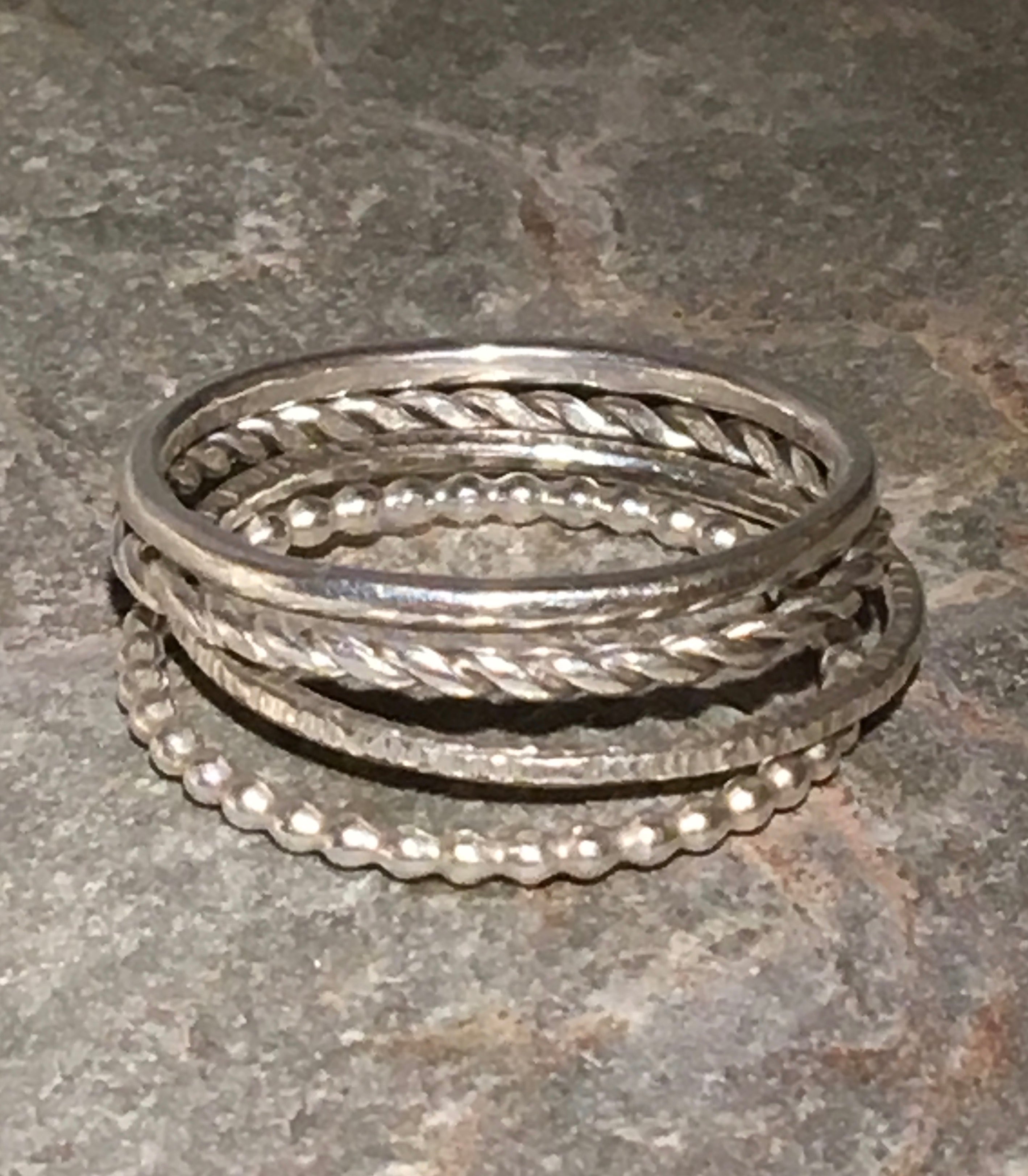 Silver Multi textured stacking ring.