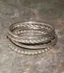 Silver Multi textured stacking ring.