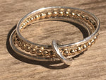 Gold and silver triple stacking ring.
