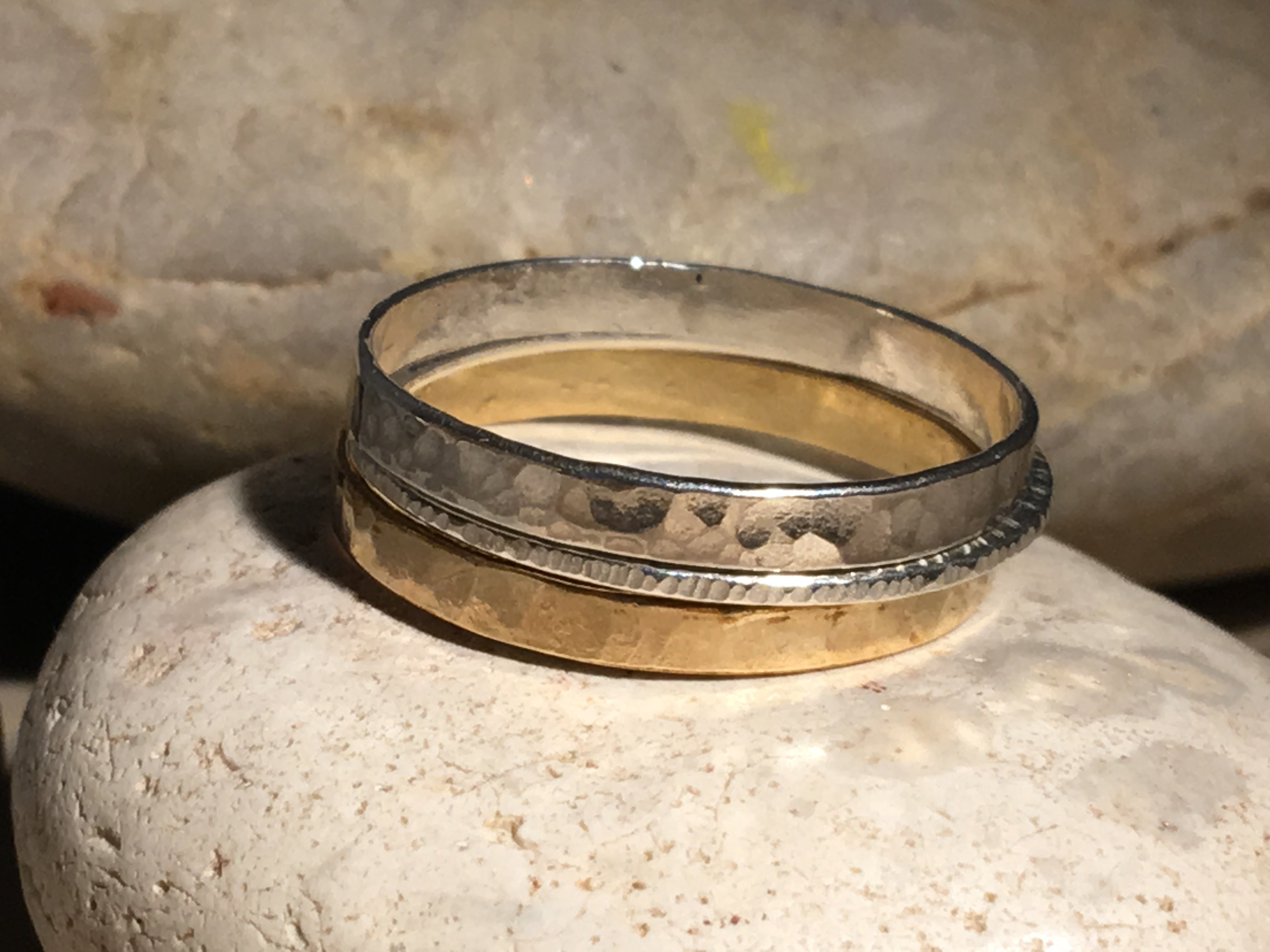 Silver and gold triple stacking ring.