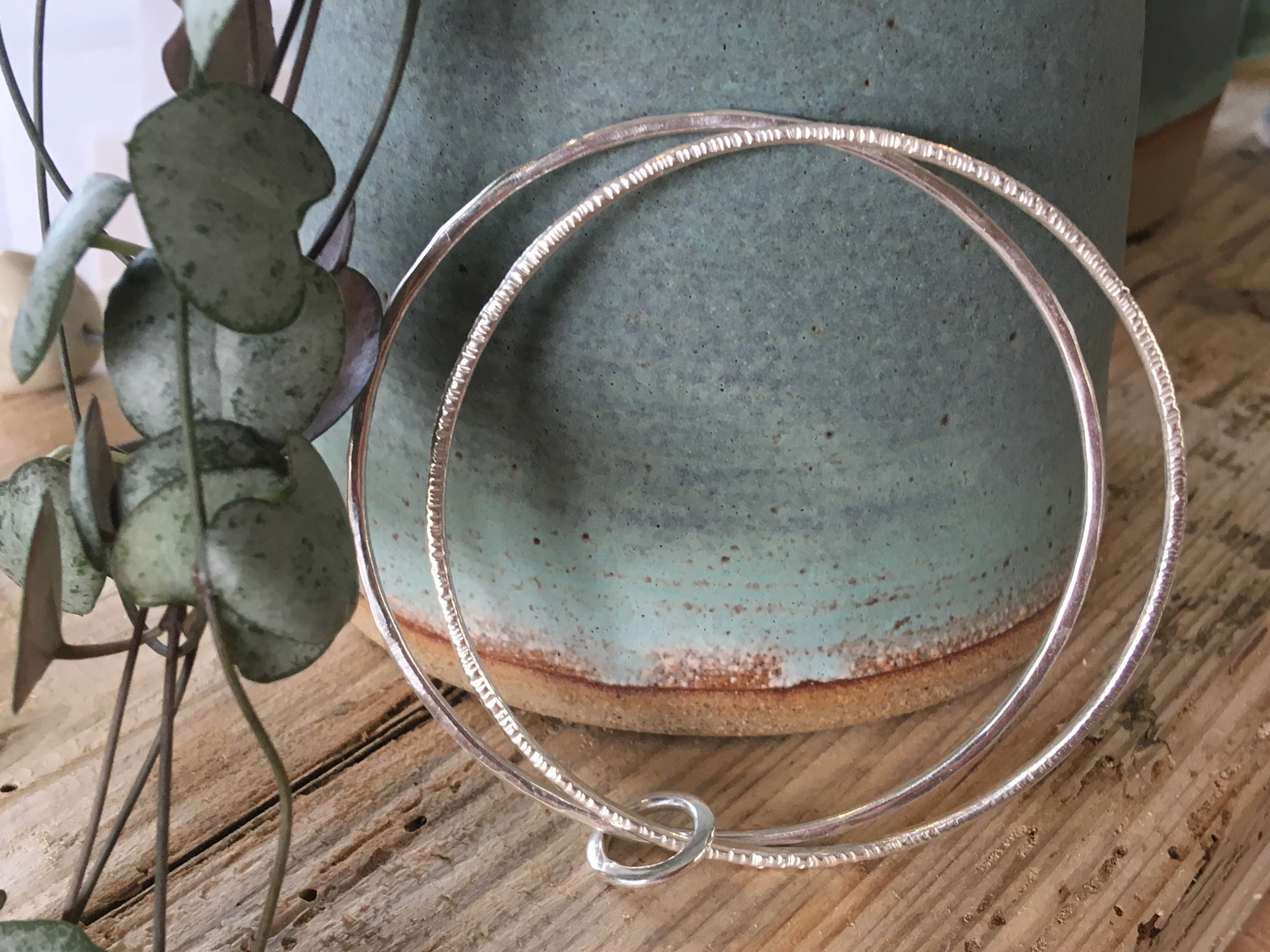 Double linked silver textured bangle.