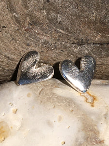 Silver heart studs.