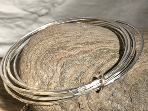 Silver stacking bracelet.